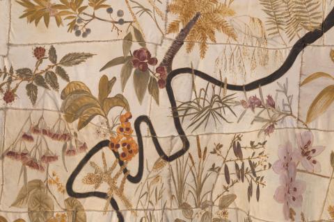 Detail view of a textile work with plants and the Brisbane river embroidered onto it