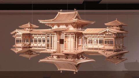 An installation view of an architectural sculpture of a Japanese temple, which is doubled as if we can see its reflection underneath