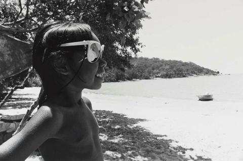 Artwork Girl with sunglasses, Yarrabah (from 'Journeys north' portfolio) this artwork made of Gelatin silver photograph on paper, created in 1986-01-01
