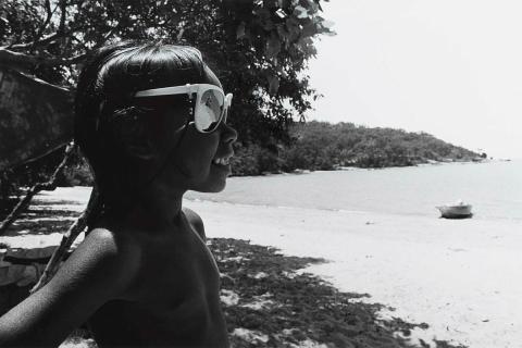 Artwork Girl with sunglasses, Yarrabah (from 'Journeys north' portfolio) this artwork made of Gelatin silver photograph on paper, created in 1986-01-01