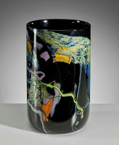 Artwork Cylinder this artwork made of Hot-worked black glass cylinder with coloured and lustred glass trails, created in 1990-01-01