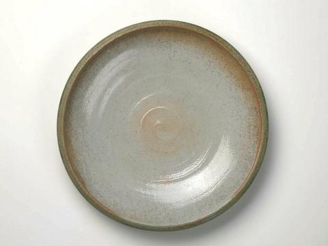 Artwork Large platter this artwork made of Thrown grey bodied stoneware clay with light Shino style glaze, created in 1979-01-01