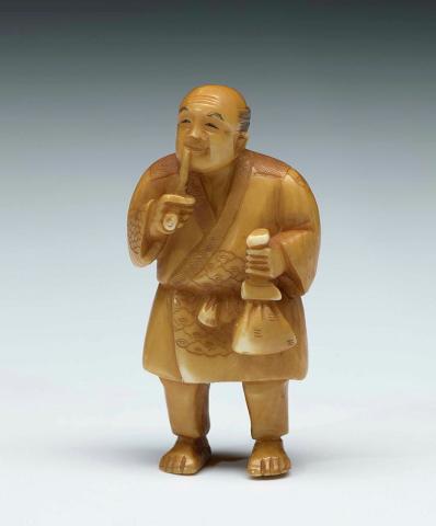 Artwork Netsuke:  (man smoking pipe) this artwork made of Ivory, carved and incised, created in 1800-01-01