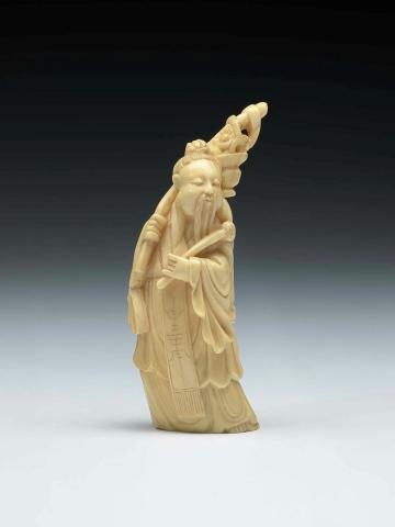 Artwork (Figure of a Chinese immortal) this artwork made of Carved ivory figure of an immortal with carved wooden stand, created in 1800-01-01