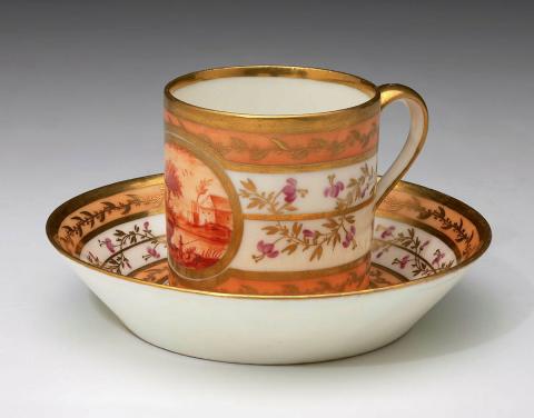 Artwork Cylindrical cup and saucer this artwork made of Soft-paste porcelain, cylindrical cup decorated with a river scene in iron red within a gilt bordered reserve on an apricot and white banded ground with entwined coloured and gilt foliage.  The saucer similarly decorated, created in 1795-01-01