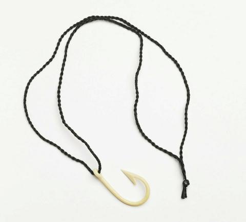 Artwork Hook this artwork made of Carved bone, cord, created in 1993-01-01