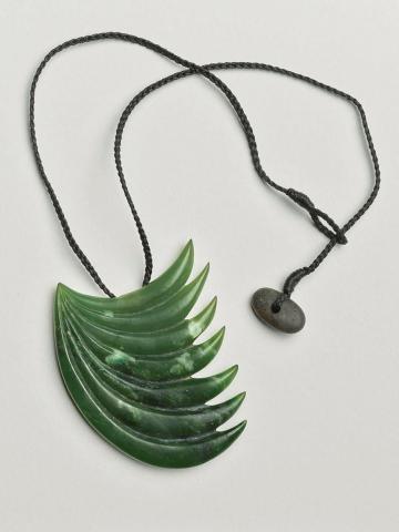 Artwork necklace this artwork made of Pounamu, nylon, shell, created in 2000-01-01