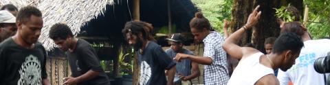 A panoramic photograph of Ni-Vanuatu people dancing.