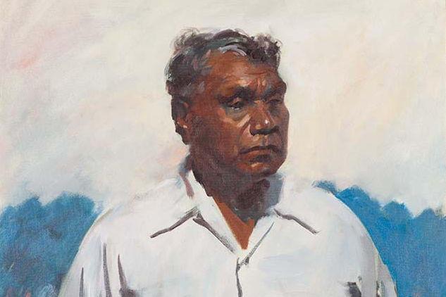 Portrait of an Indigenous man with a cloudy sky behind him