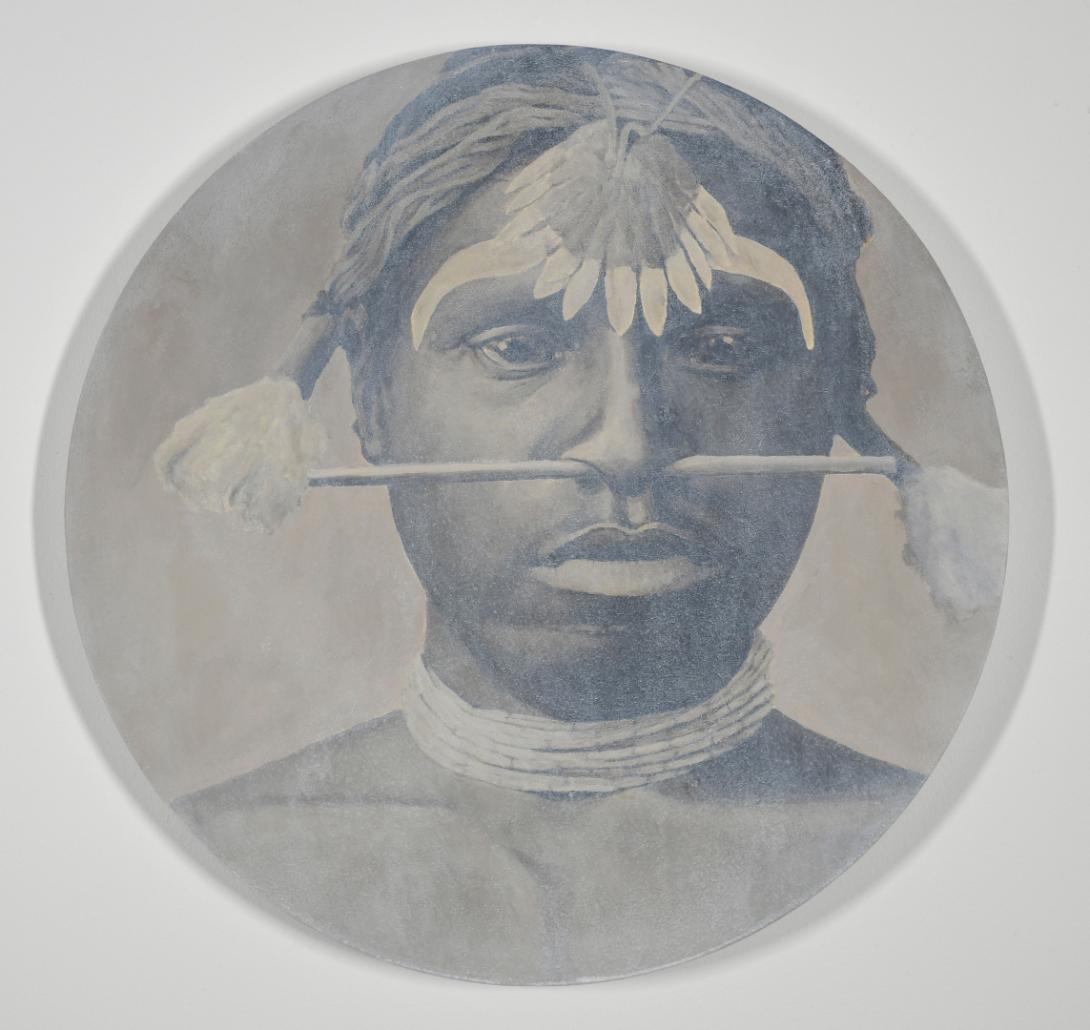A slightly off-centre circular portrait, painted in pale sepia tones to emulate an anthropological style of photograph, showing a First Nations Australian man wearing a traditional feathered headdress and a slim bar through his septum that spans the width of his face.