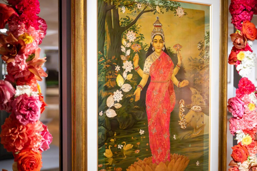 Raja Ravi Varma's Laxmi 1894, printed by the Ravi Varma Press c.1910–20, garlanded with flowers for the official opening of 'The God of Small Things', QAG, September 2025 / © The artists / Photograph: N Umek, QAGOMA