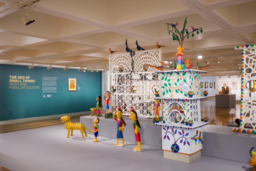 An installation view of colourful clay figures in a gallery space