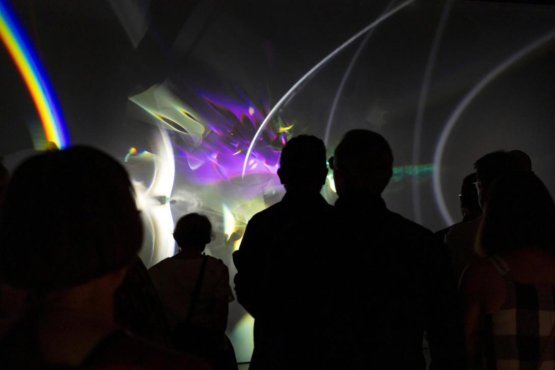 Olafur Eliasson / Denmark b.1967 / Pluriverse assembly 2021, installed for 'Presence', GOMA, 2025 / Projection screen, LED projectors, motors, electrical ballasts, control units, aluminium, brass, steel, stainless steel, plastics, lenses, optical components, glass, wood, dichroic filters, wire, fabric, paraffin oil, plants / Courtesy: The artist; neugerriemschneider, Berlin; and Tanya Bonakdar Gallery, New York / © 2021 Olafur Eliasson / Photograph: K Bennett, QAGOMA