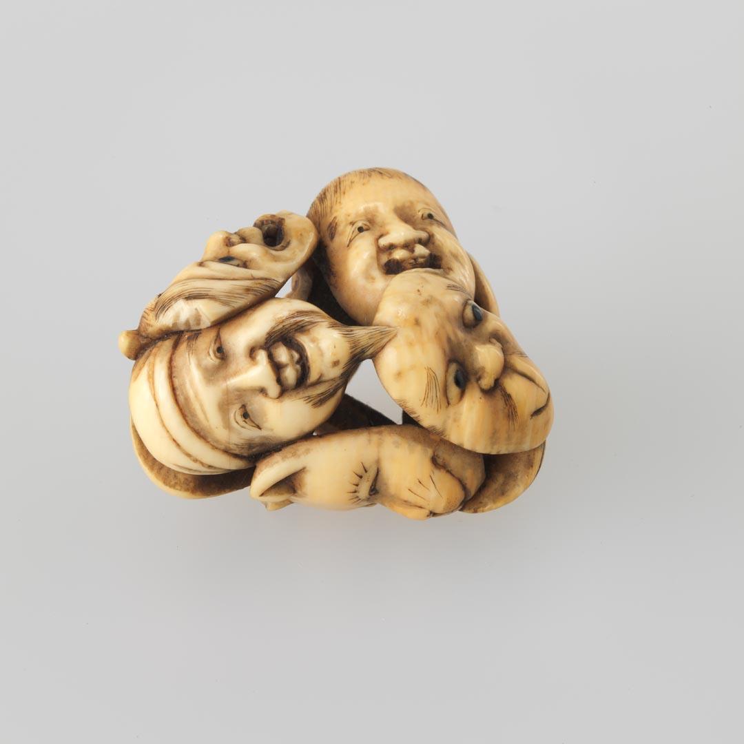 Artwork Netsuke:  (nine masks) this artwork made of Carved ivory, created in 1850-01-01