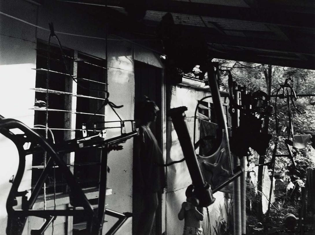 Artwork 23 December 1986, Slade Point, Mackay - Linda's husband had painted parts of his motorcycle and hung them on the back verandah.  The backyard led down to the Pacific Ocean (from 'Journeys north' portfolio) this artwork made of Gelatin silver photograph on paper, created in 1986-01-01