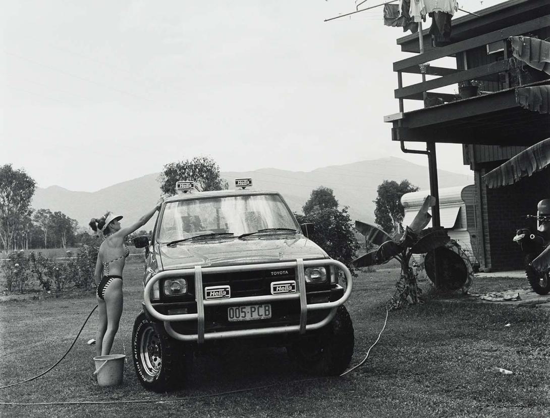 Artwork 16 January 1987, Gordonvale - Catherine washed her four wheel drive at her parents' cane farm (from 'Journeys north' portfolio) this artwork made of Gelatin silver photograph on paper, created in 1987-01-01