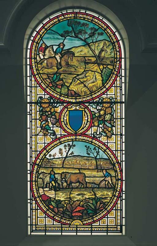 Artwork Sidney House stained glass window this artwork made of Coloured and stained glass window in two panels - the upper (arched) panel depicting a kangaroo hunt and the lower a farming scene, created in 1880-01-01