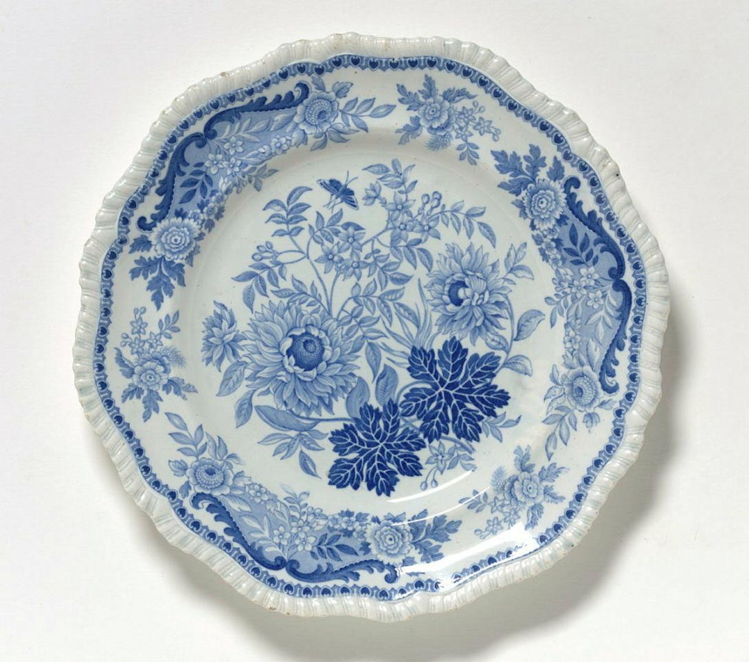 Artwork Plate:  Jasmine this artwork made of Earthenware plate with gadrooned edge transfer printed in underglaze cobalt, created in 1825-01-01