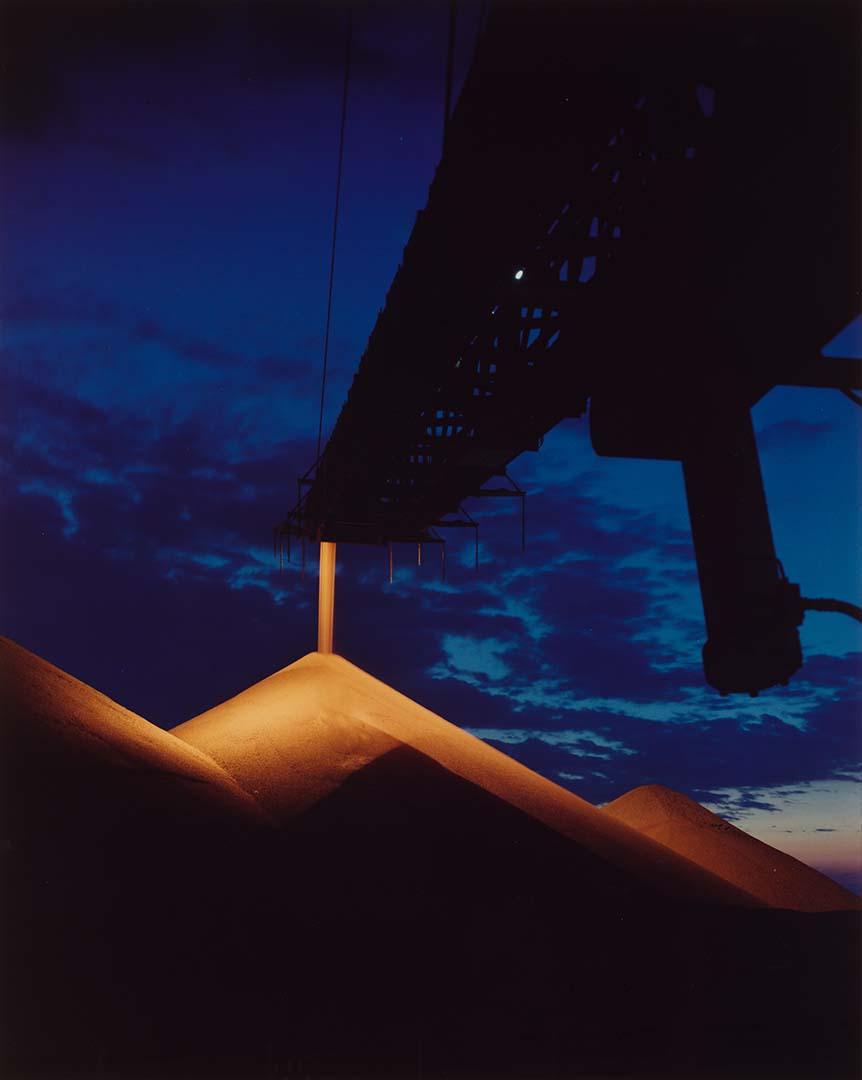 Artwork Travelling stacker working on the bauxite stockpile, Weipa, Cape York this artwork made of Type C photograph on paper, created in 1971-01-01