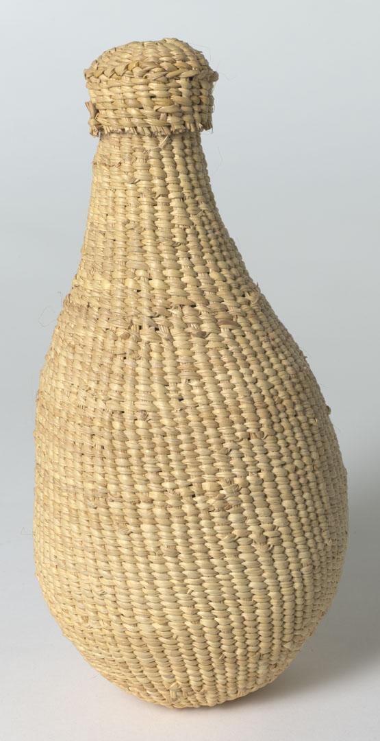 Artwork (Bottle form) this artwork made of Woven pandanus with traditional dyes, created in 2000-01-01