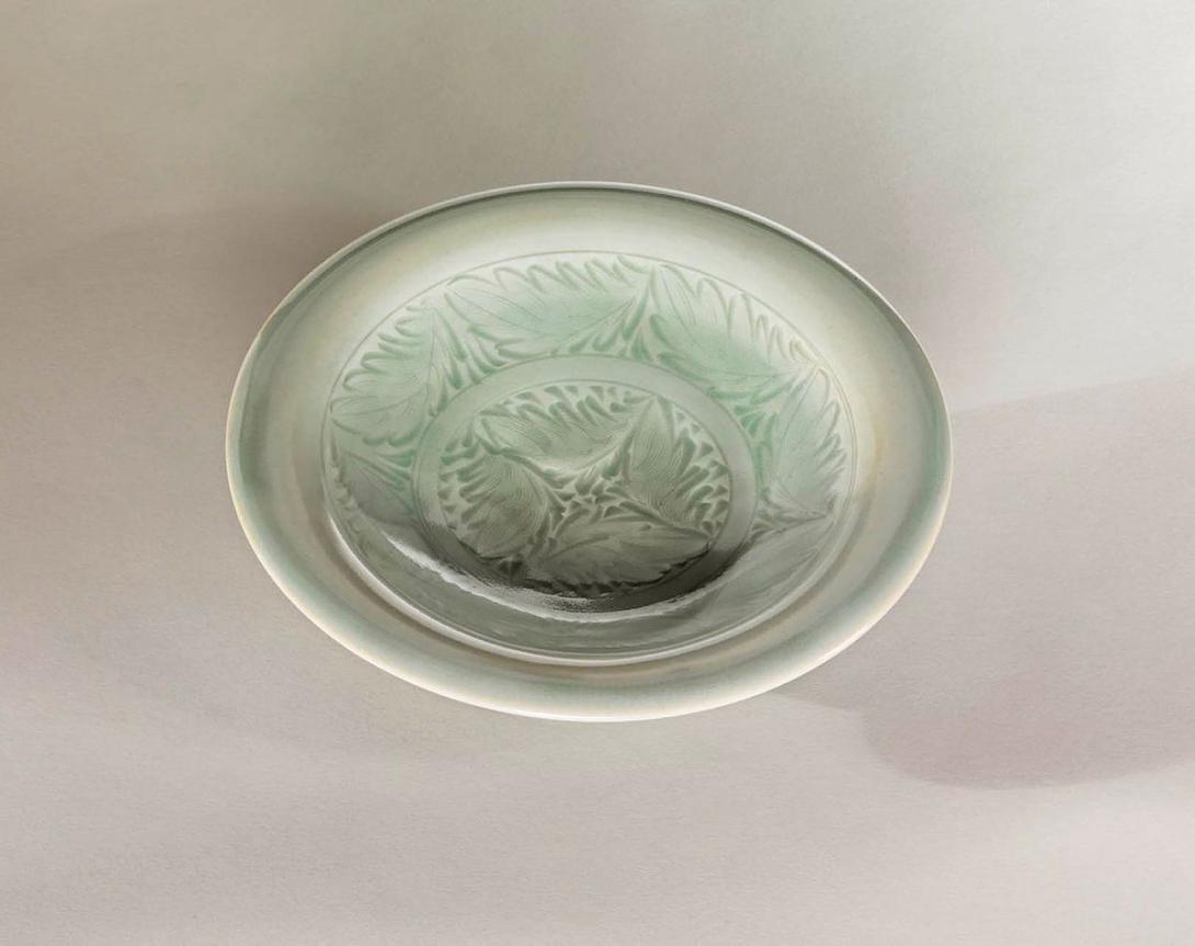 Artwork Celadon plate this artwork made of Stoneware, wheelthrown with incised circular design of leaves and pale celadon glaze, created in 1978-01-01