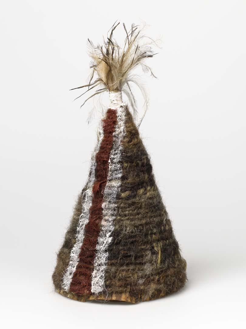 Artwork Ceremonial dance hat this artwork made of Paperbark with wood, string, human hair, natural pigments and emu feathers, created in 2010-01-01