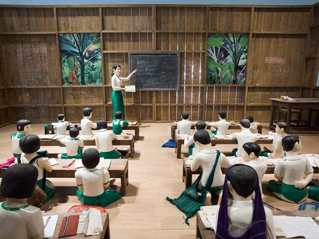 Artwork The sick classroom this artwork made of 27 painted, wooden sculptures; eight wooden desks; 26 student accessories; one wooden table; one wooden chair; 15 inkjet prints on paper, ed. 1/5; single-channel video: 13:19 minutes, colour, sound, ed. 1/5, created in 2012-01-01