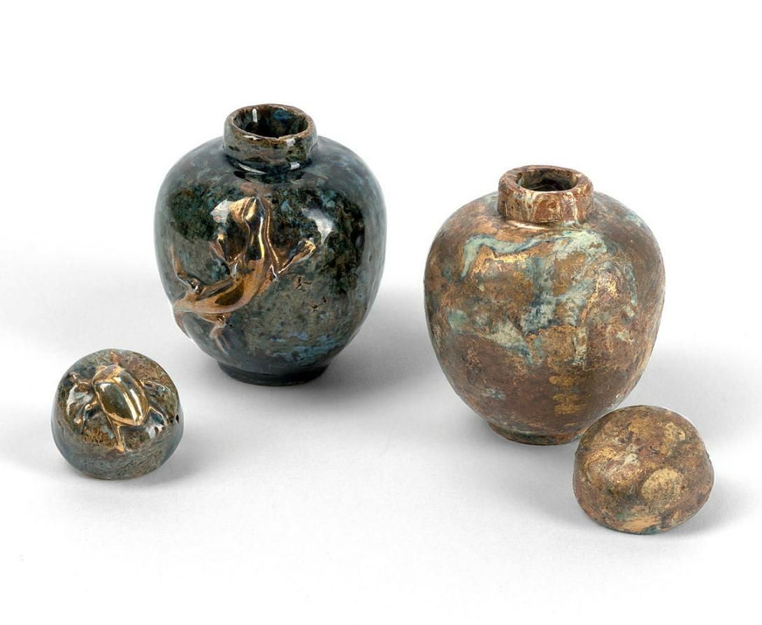 Artwork Two covered vases this artwork made of Earthenware, one with gilt lizard and with beetle on the lid, one with metallic glazes, created in 1920-01-01