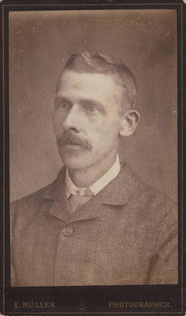 Artwork (Man in buttoned jacket, Toowoomba) this artwork made of Albumen photograph on paper mounted on card, created in 1885-01-01