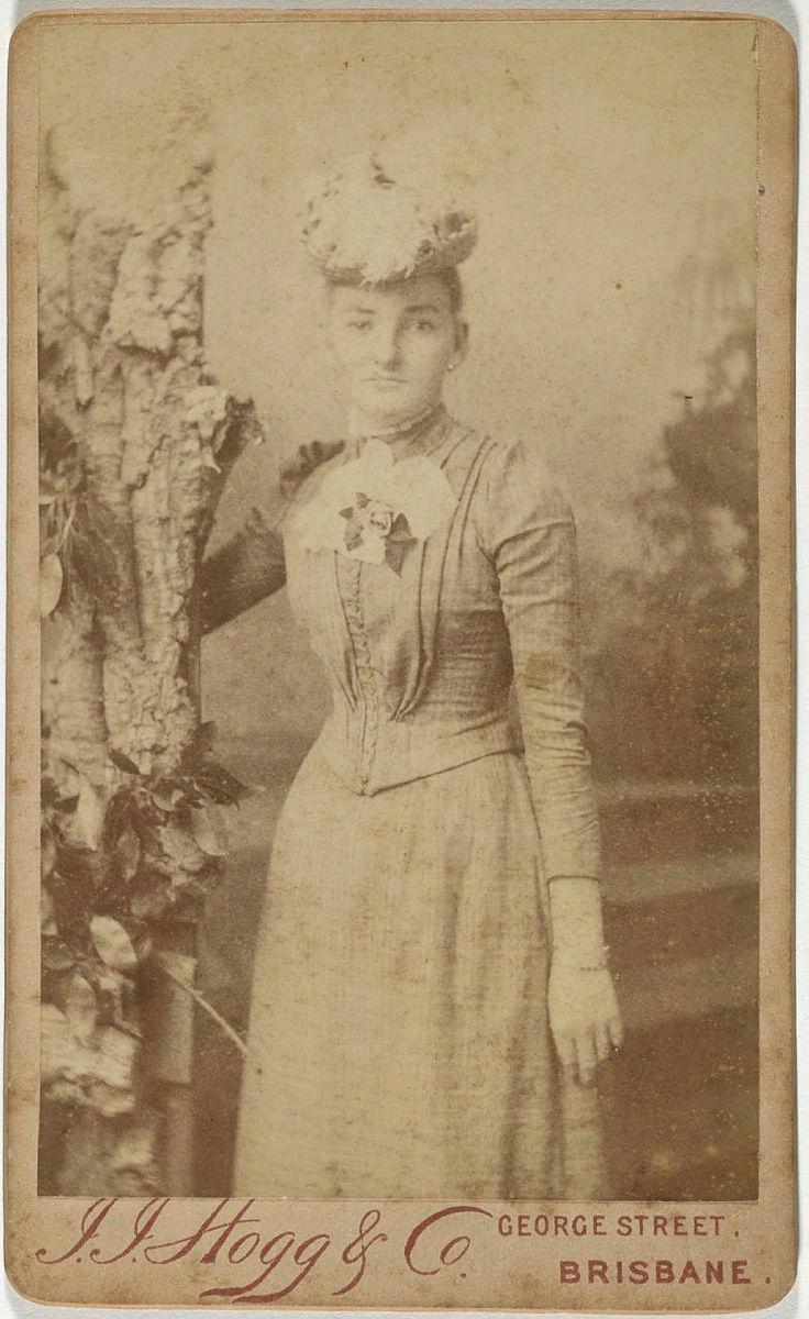 Artwork (Young woman beside tree prop) this artwork made of Albumen photograph on paper mounted on card, created in 1890-01-01