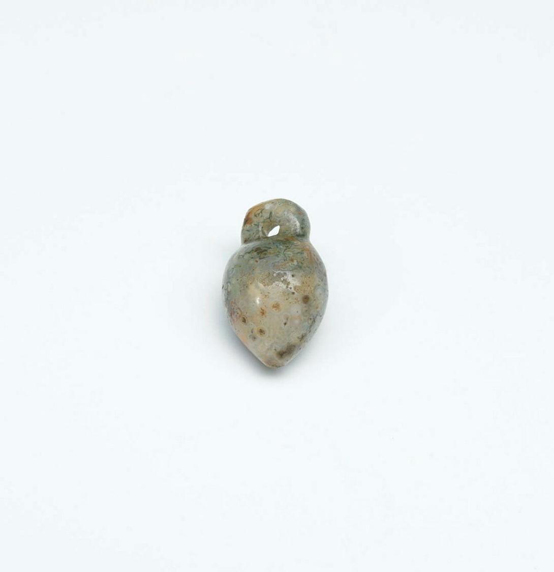 Artwork Amulet this artwork made of Green jade, carved