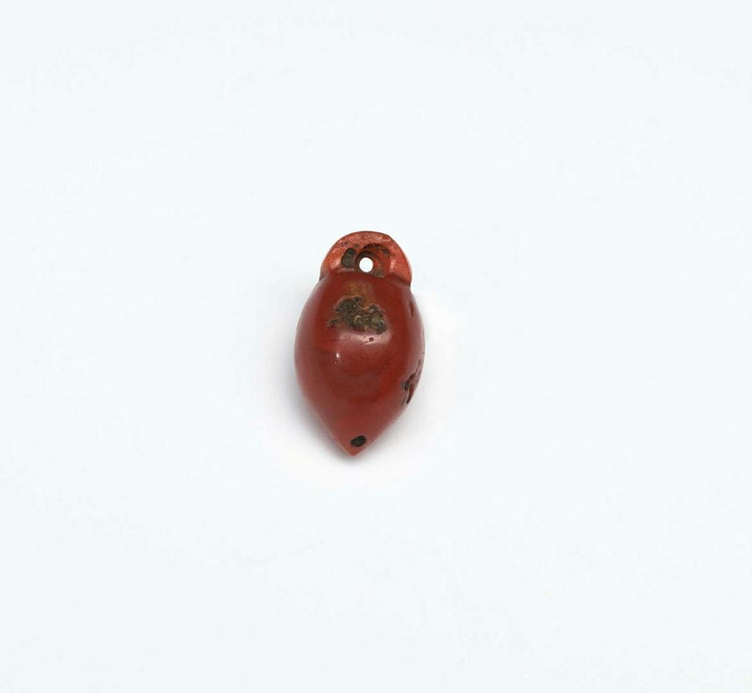 Artwork Amulet this artwork made of Brown jade, carved, created in 1975-01-01