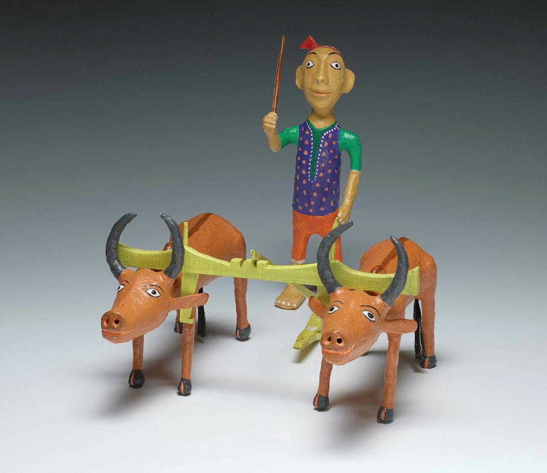 Artwork Kissan (ploughing man); two bullocks this artwork made of Multani clay, natural colour, plant fibre, created in 2015-01-01