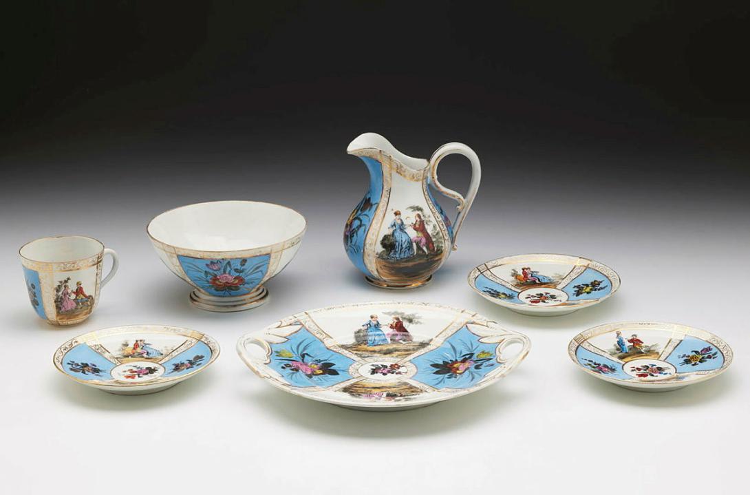 Artwork Tea service (portion) this artwork made of Hard-paste porcelain printed in black with courtship scenes in a landscape setting hand coloured.  Blue panels, created in 1850-01-01