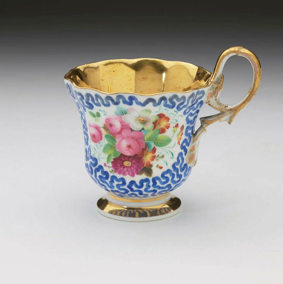 Artwork Cup and saucer this artwork made of Hard-paste porcelain, fluted shape with polychrome floral reserves and royal blue vermicilli ground.  Heavily gilded