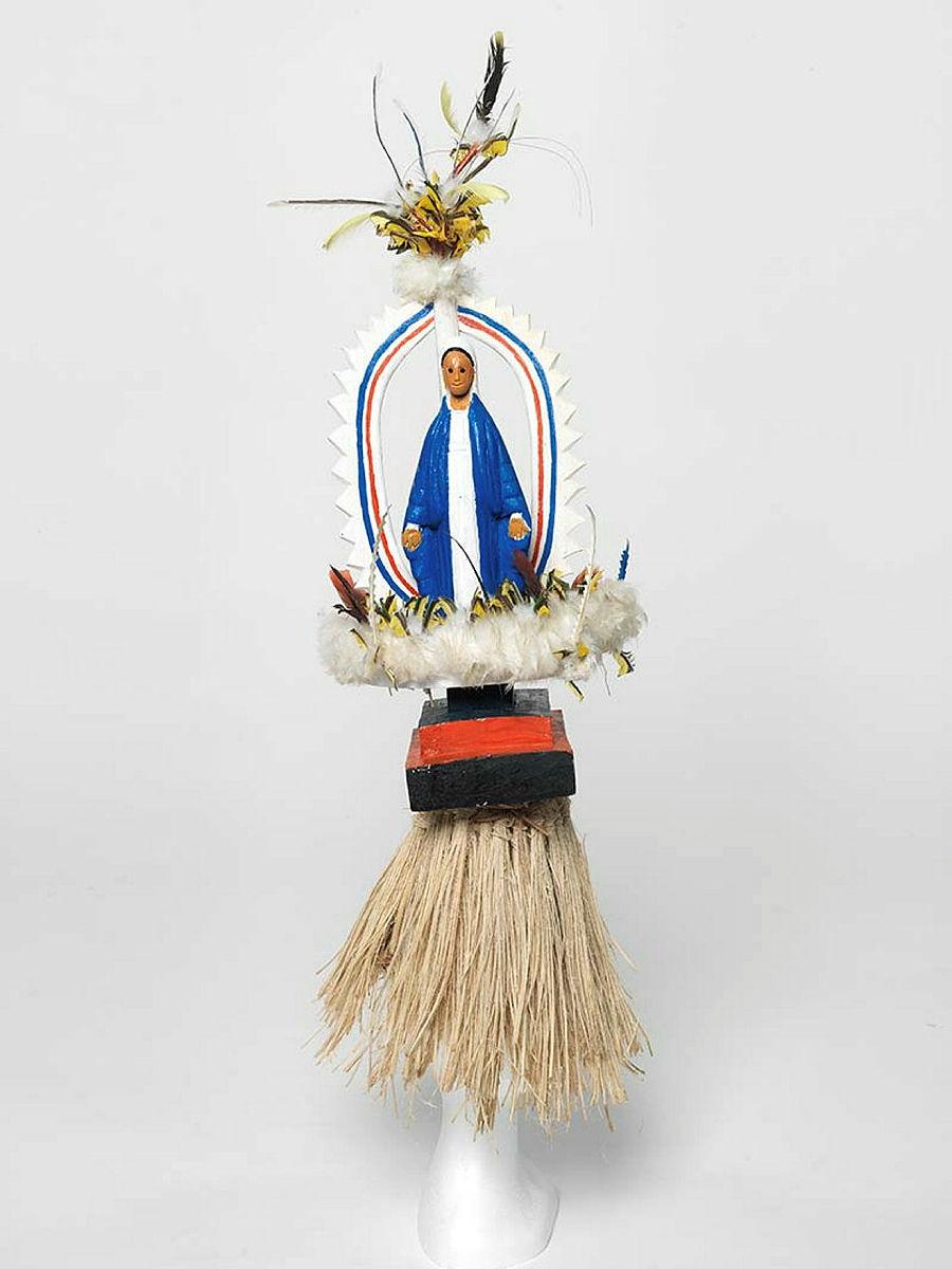 Artwork Mary this artwork made of Tokatokoi, headdress: wood, feathers, plastic Virgin Mary figurine, synthetic polymer paint, grass fibre, created in 2011-01-01