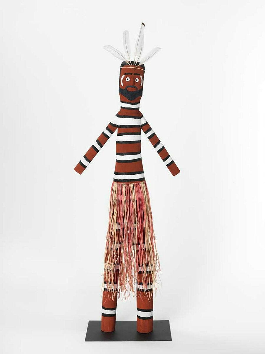 Artwork Thuuth (Striped protector and storyteller wearing grass skirt) this artwork made of Carved milkwood with synthetic polymer paint, natural pigments, ibis feathers and natural fibres, created in 2004-01-01