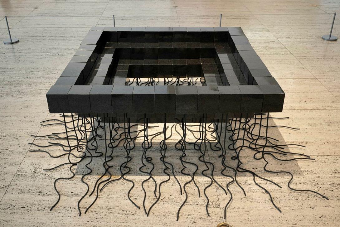 Artwork Inverted stepped pyramid this artwork made of Polished granite cubes, mild steel