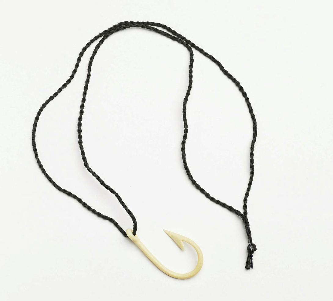 Artwork Hook this artwork made of Carved bone, cord, created in 1993-01-01