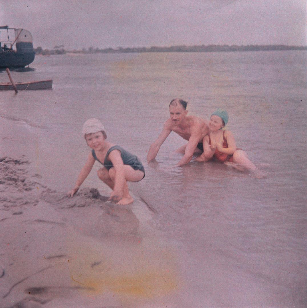 Artwork (J.H. Simmonds, Rosemary in the water, and unidentified small girl making sand-castles) this artwork made of Cellulose acetate Dufay colour transparency (originally in a glass mount), created in 1935-01-01