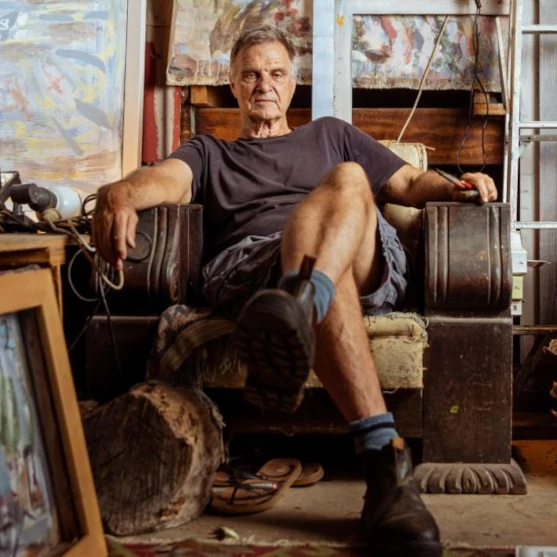Artist Joe Furlonger, seated in his studio