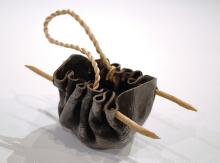 Installation view of a water carrier made from bull kelp, ti-tree wood skewers and spun plant fibre string.