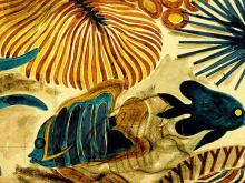 A detail shot of a fish sketch behind fish in a coral reef textile design by Olive Ashworth, only visible under transmitted light.