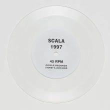 A transparent vinyl record with black text 'Scala 1997 45 RPM Circle Records Sydney & Auckland' printed on a white label.