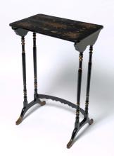A dark timber lacquered table from the Qing dynasty, with gilded detailing on the legs and hand painted floral designs on the top.