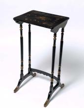 A dark timber lacquered table from the Qing dynasty, with gilded detailing on the legs and hand painted floral designs on the top.