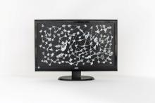 An abstract artwork that looks like a starry cosmos on a black background, painted onto a tv monitor.