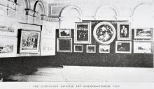 A black-and-white photograph of an art gallery in the late 1800s.
