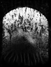 A drypoint print depicting a veiled scene of war framed in an archway; the work is rendered in black and white