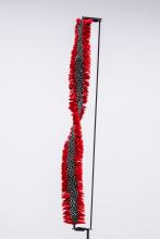 A sculptural artwork representing a royal standard, made from red-dyed goose and guinea fowl feathers